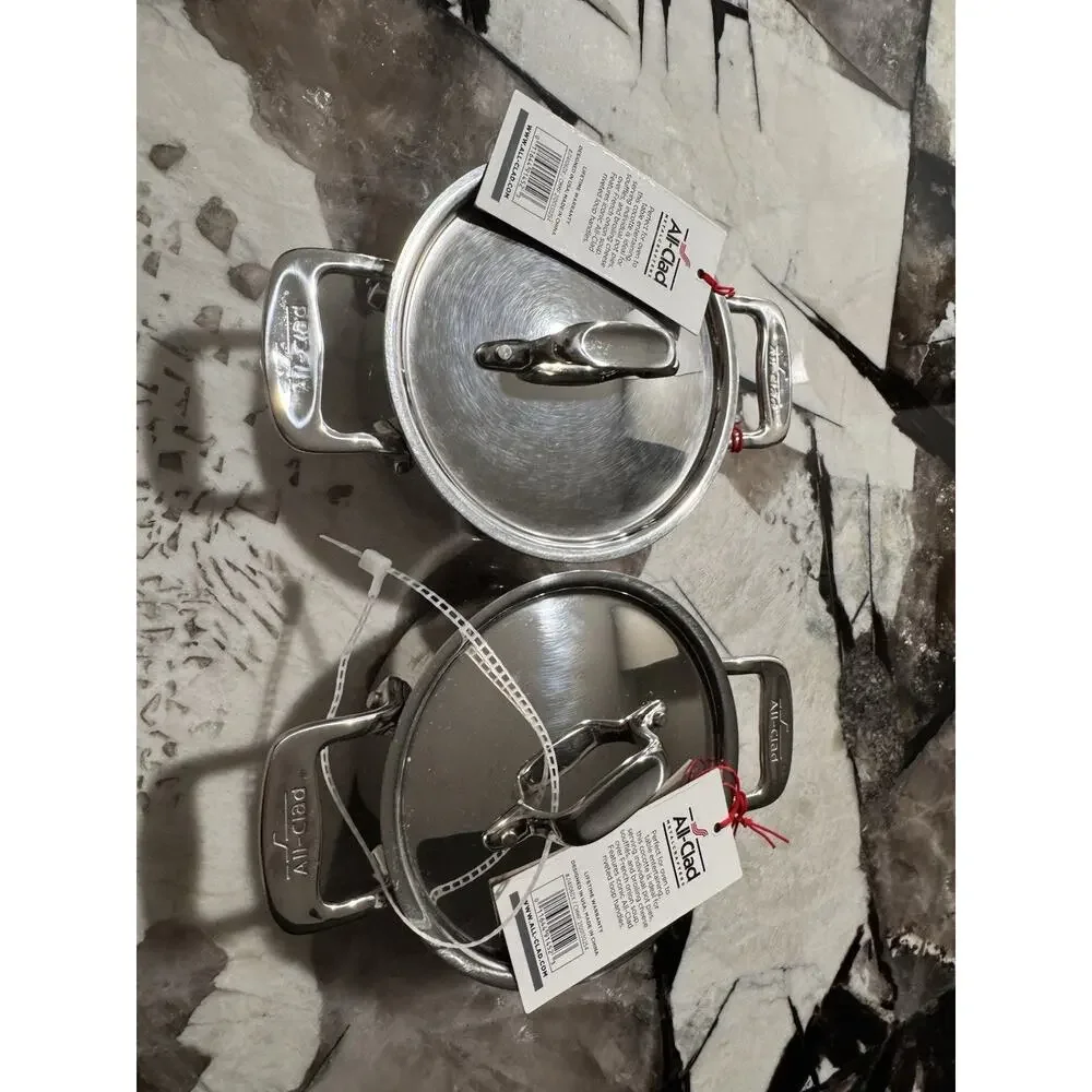 Two ALL CLAD Stainless Steel 1/2 QT. Cocotte with Lids. New. Lifetime Warranty